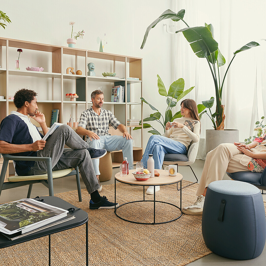 people sitting and chatting in an office context