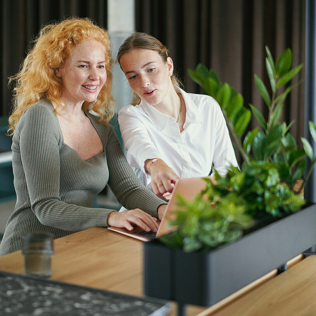 Two women sitting at a desk